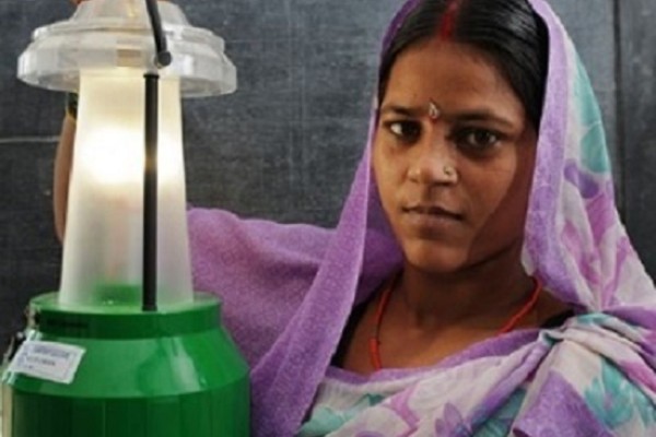 Woman with solar lamp in India