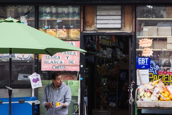 A vendor in Brooklyn, where hot days currently bring dirty power for cooling.